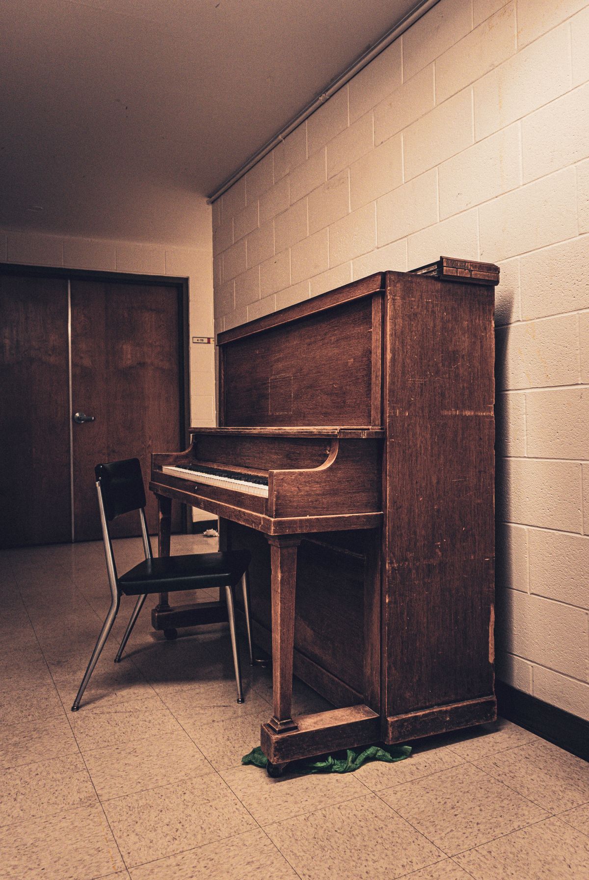 An upright piano standing in a room