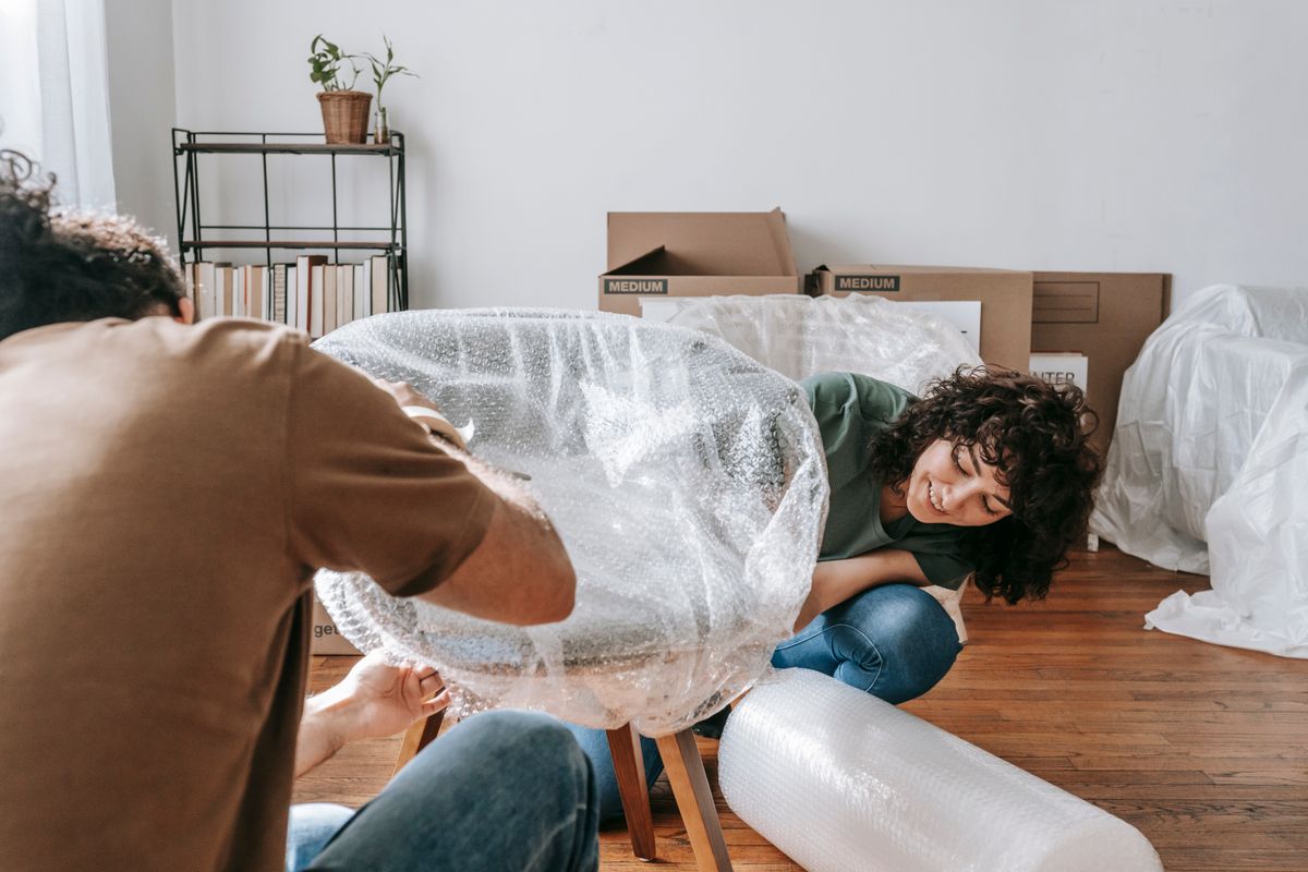 Furniture being wrapped in bubble wrap for a move
